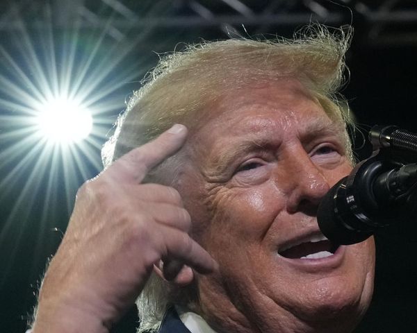 Trump targets Ilhan Omar at rally following raid on her home – US politics live