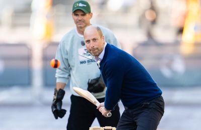 William, Prince of Wales, plays cricket on The Mall