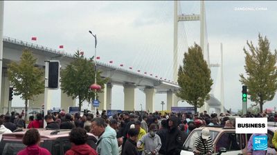 China, North Korea open long-delayed trade bridge