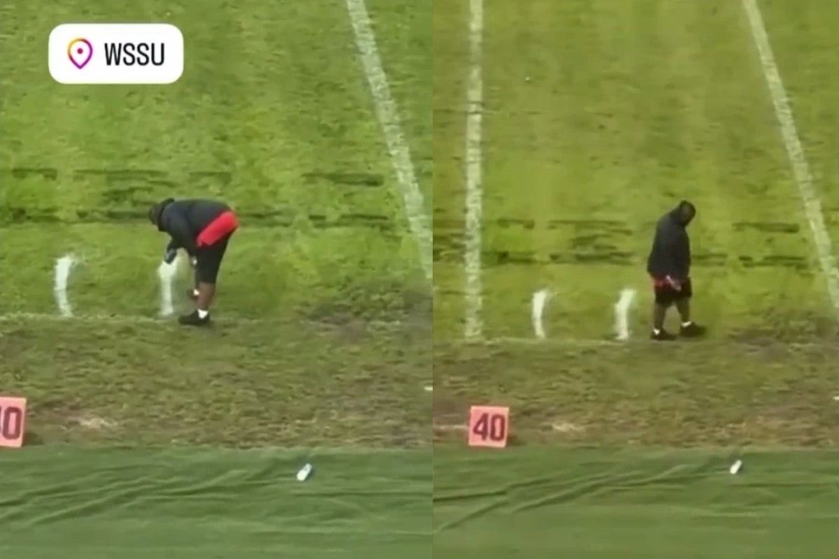College football line painter spotted measuring field…