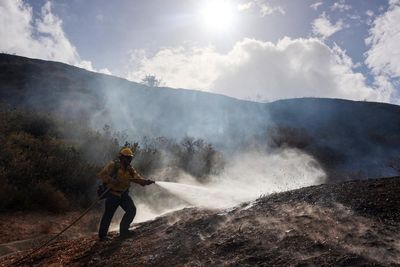 Evacuations issued as multiple wildfires ignite in hot, windy California