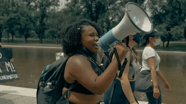Austin couple mocked Black college students over parking and flaunted their $1.5 million home. The students’ response turned their street into a protest party