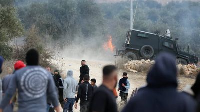 Israeli settlers attack Palestinian villages, torch cars and trees during olive harvest