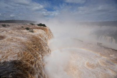 El Niño rains flood South America, sending residents fleeing and cattle swimming