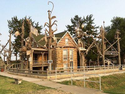 At 64, retired Kansas teacher and farmer S.P. Dinsmoor began building his Garden of Eden with concrete sculptures; the property later became a tourist attraction