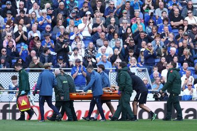 Emi Martinez stretched off pitch after clashing heads with Everton star