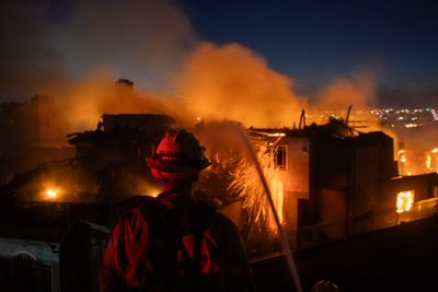 California wildfire forces thousands to evacuate as blaze destroys coastal homes