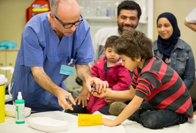 Nearly 2,000 Iowa Refugees Hit by Medicaid Cutoff, Local Groups Estimate, as Counties Point Families to Free Clinics