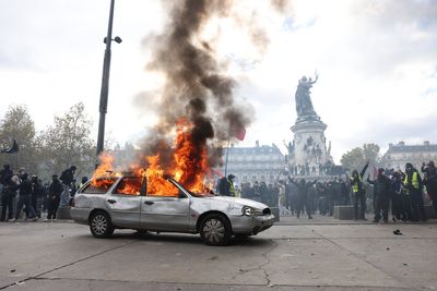 France protests latest: Paris and Nice impose curfews as Trump tries to exploit riots for midterm gains