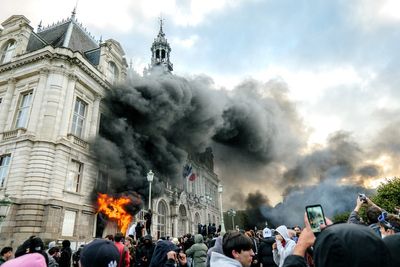 French mayor calls for Notre Dame-style rebuild after historic town hall set on fire by rioters