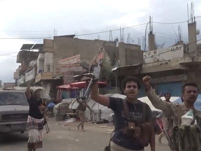 Houthi rebels strike a government military camp in southern Yemen, killing at least 53 fighters