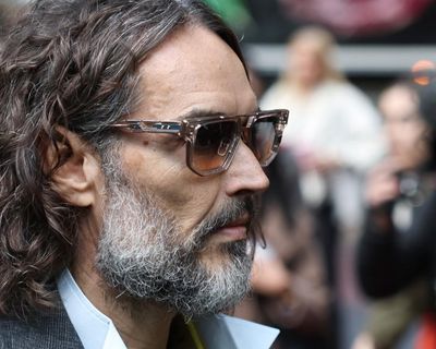 Russell Brand had ‘maniacal grin’ as he dragged woman into toilet and raped her, court told