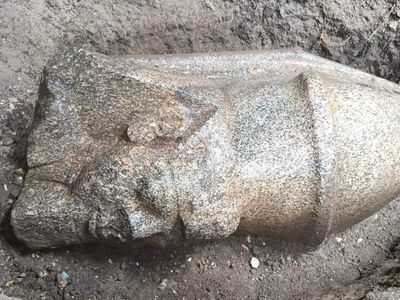 An Egyptian farmer found a mysterious pink stone in his field — it led archaeologists to two giant statues of Ramses II buried for centuries