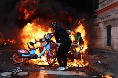 France protests latest: Suspect arrested over city hall fire as French PM says curfews are working