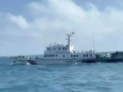 China sends naval forces to monitor US warship near disputed shoal