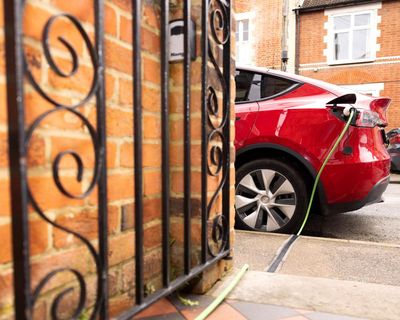 ‘I can charge my car for £6’: could new rules cut costs for EV drivers?