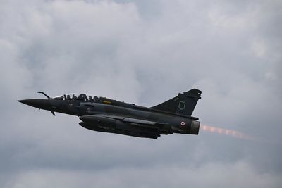 Fighter jet crashes and explodes into fireball in France with one dead and search launched for missing crew member