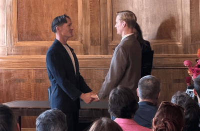 British band frontman marries partner in low-key east London ceremony with pop star guest
