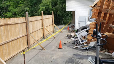 Sliced Garage Still Standing: Maine man cut neighbor’s in half; landmark still awaits removal