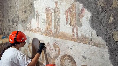 Restorers work to preserve frescoes in one of Pompeii’s grandest Roman houses