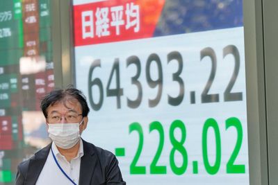 Asian shares retreat after strong profits lead a rally on Wall Street