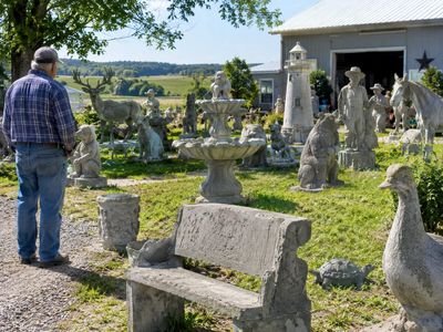 Nick Engelbert was a Wisconsin dairy farmer when a sprained ankle led him to make one concrete sculpture; 15 years later, his yard held more than 40 statues