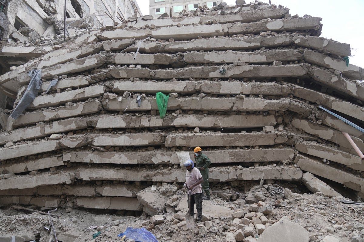 Many feared trapped as a tall building collapses in…