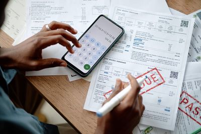 Americans Are Paying $1,257 a Month Toward Debt — And Some Are Still Falling Behind