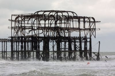 Part of historic Brighton pier collapses as storms bring heavy disruption