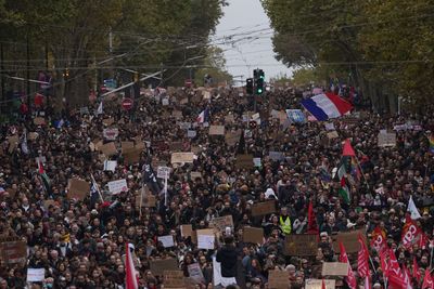 Thousands march in France over schools and living costs as police use tear gas