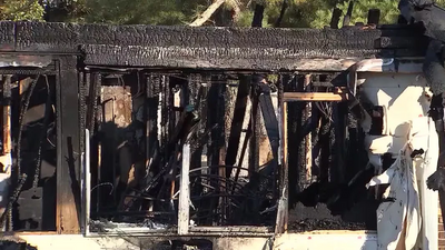 A wrong turn in Georgia led an Alabama driver to rescue a sleeping family of 14 from a house fire