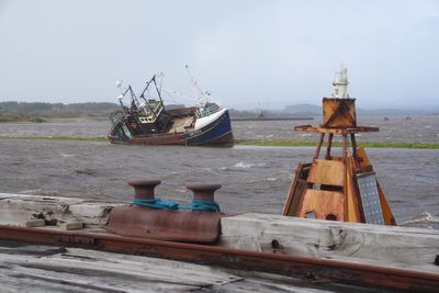 Coastal communities told to remain vigilant for floods as wind warnings lifted