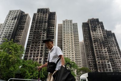 Hong Kong's housing minister resigns after fire investigation finds inadequate oversight