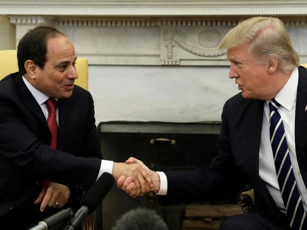 Donald Trump shakes hands with Egypt's President Sisi, two weeks after shunning Angela Merkel