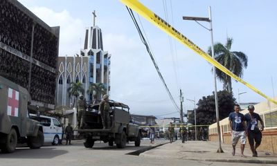 Philippines Vows to 'Crush' Attackers After Church Bombings Kill at Least 20