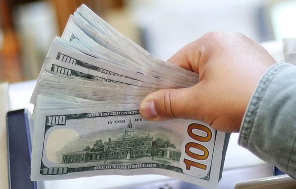 Dollar near flat, heading for fourth straight month of gains