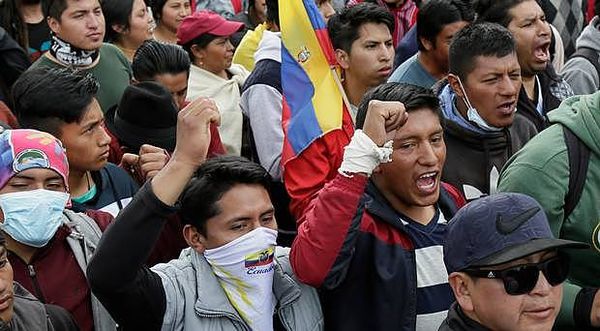Protesters parade captured police in Ecuador capital
