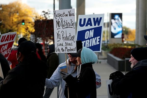 UAW says GM strike to continue until workers vote on deal