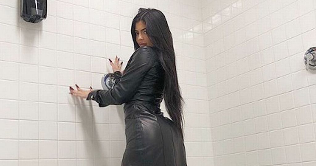 Kylie Jenner teases her figure as she poses in the