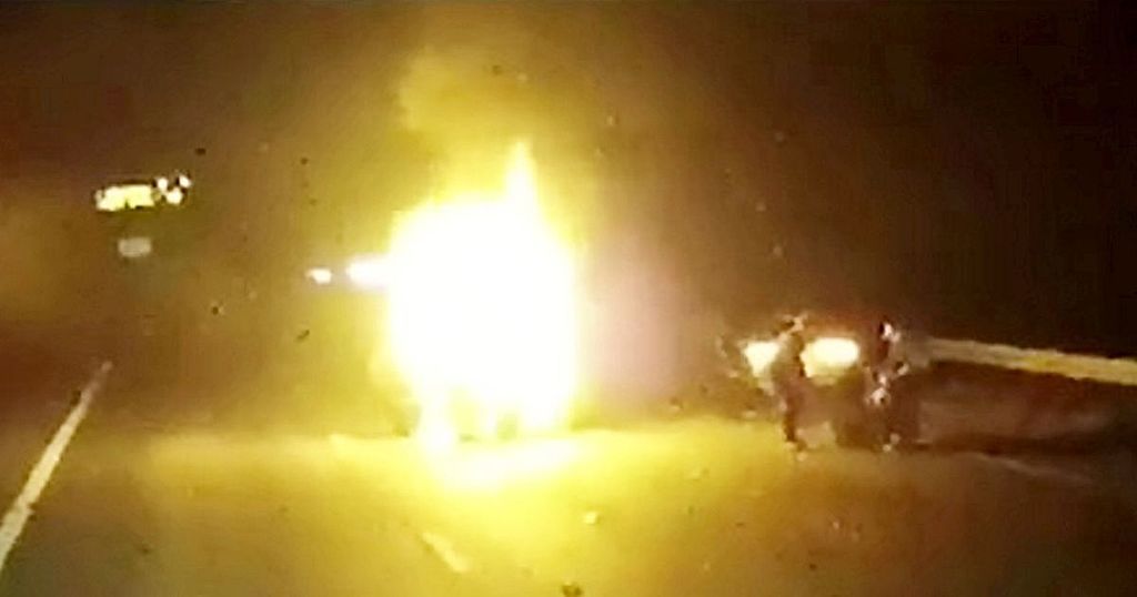 Moment hero lorry driver pulls woman from burning car…