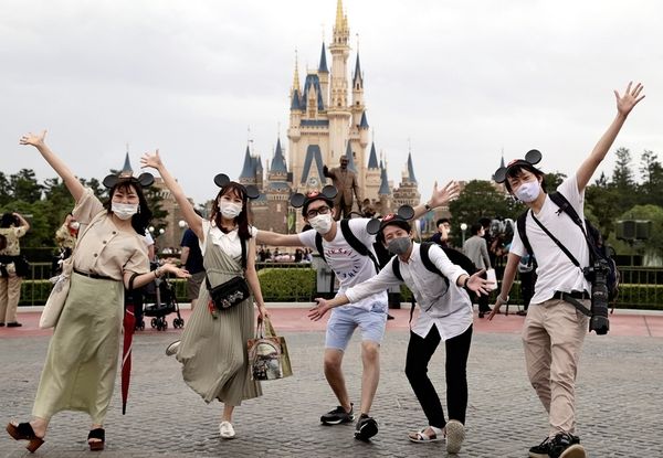 Reopened Tokyo Disneyland puts distance between Mickey Mouse, visitors