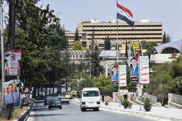War-torn Syria goes to the polls amid economic crisis