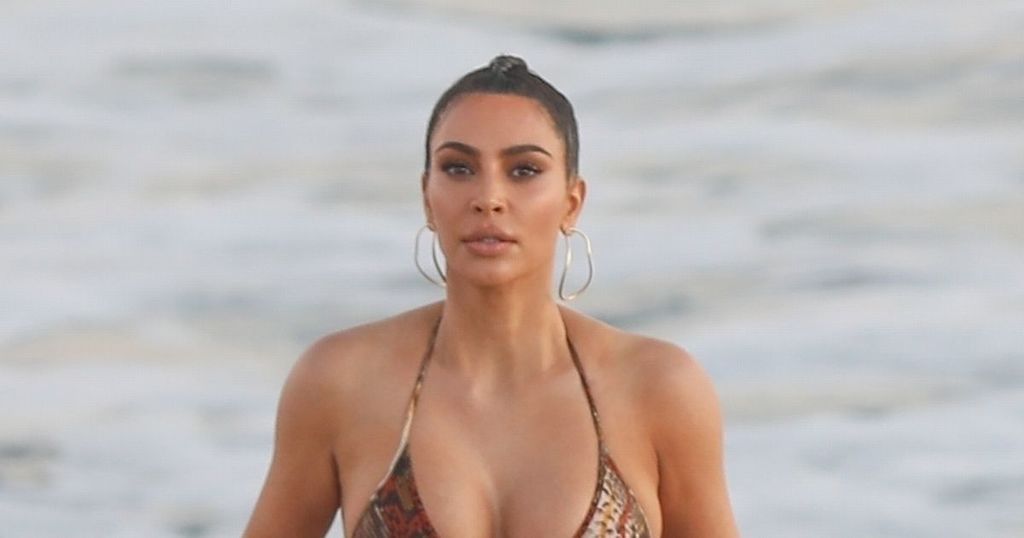 Kim Kardashian puts on an eye-popping display in plunging snakeskin bra top  as she shares her Bali