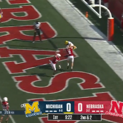 Michigan WR Roman Wilson mossed a Nebraska defender for a brilliant touchdown
